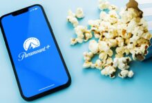 Paramount Plus app on a phone next to popcorn