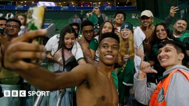 Estevao Willian poses for a selfie with a group of Palmeiras fans