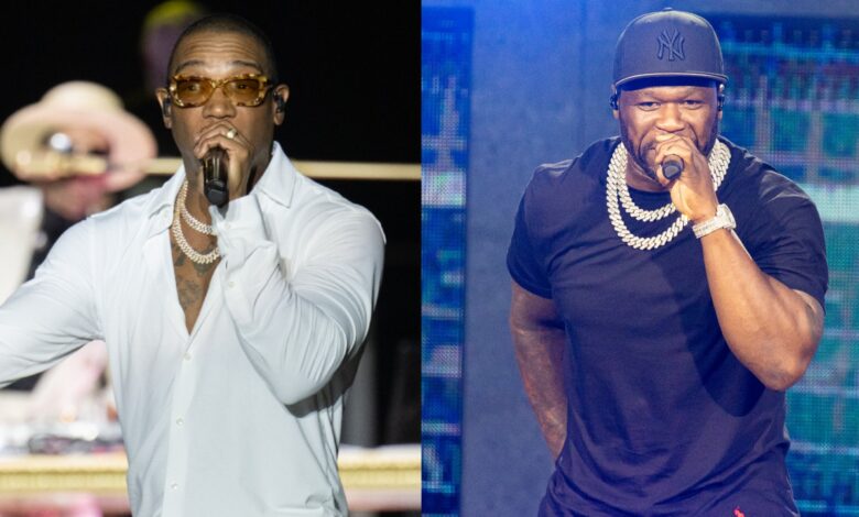 Ja Rule in a white shirt performing, and 50 Cent in a black shirt and cap, both holding microphones on stage.