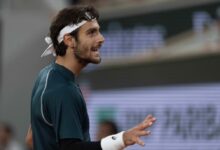 Lorenzo Musetti of Italy reacts to a point during his match against Carlos Alcaraz of Spain match on day 13 at Roland Garros Stadium.