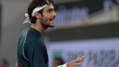 Lorenzo Musetti of Italy reacts to a point during his match against Carlos Alcaraz of Spain match on day 13 at Roland Garros Stadium.