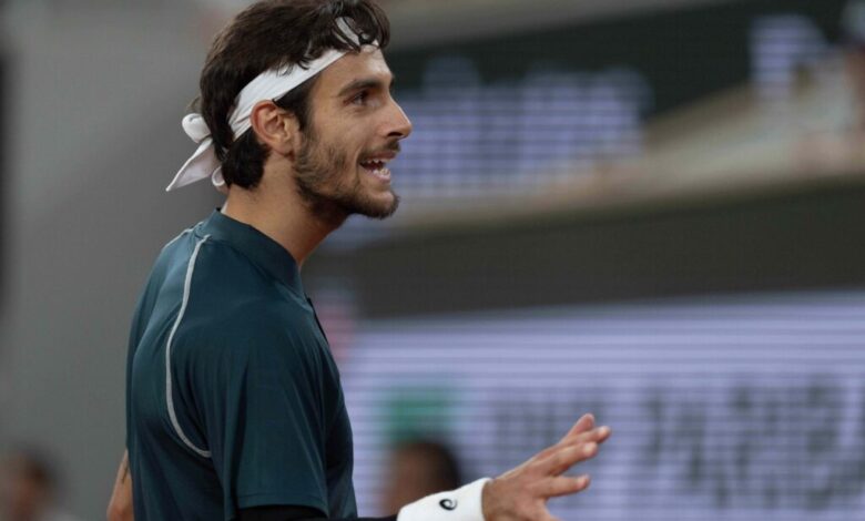Lorenzo Musetti of Italy reacts to a point during his match against Carlos Alcaraz of Spain match on day 13 at Roland Garros Stadium.