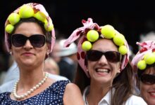 LONDON, ENGLAND - JUNE 26: Tennis fans at the Gilles Muller v Roger Federer match on centre court during day four of the Wimbledon Championships at Wimbledon in London, England. (Photo by Karwai Tang/WireImage)