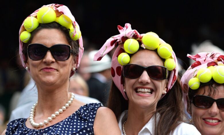 LONDON, ENGLAND - JUNE 26: Tennis fans at the Gilles Muller v Roger Federer match on centre court during day four of the Wimbledon Championships at Wimbledon in London, England. (Photo by Karwai Tang/WireImage)